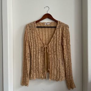 Peach colored knit front tie shirt